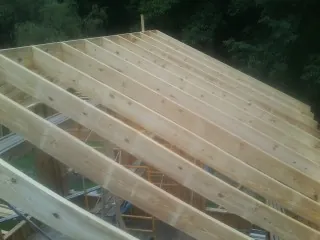 New roof rafters set over an addition before sheathing in Gallipolis